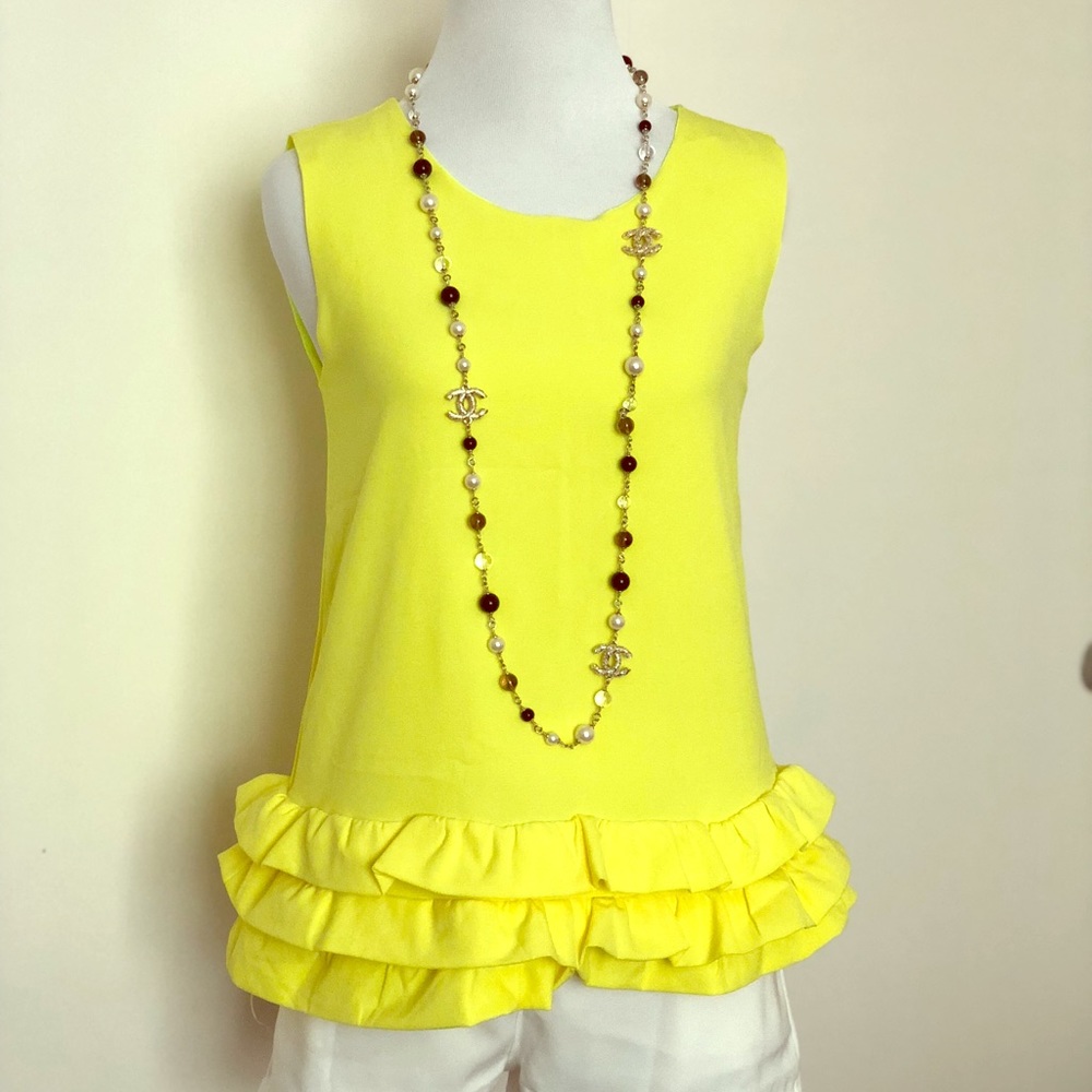 yellow peplum sleeveless top